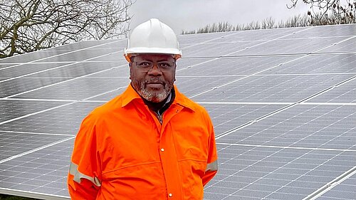 Lib Dem Ade Adeyemo at a solar farm